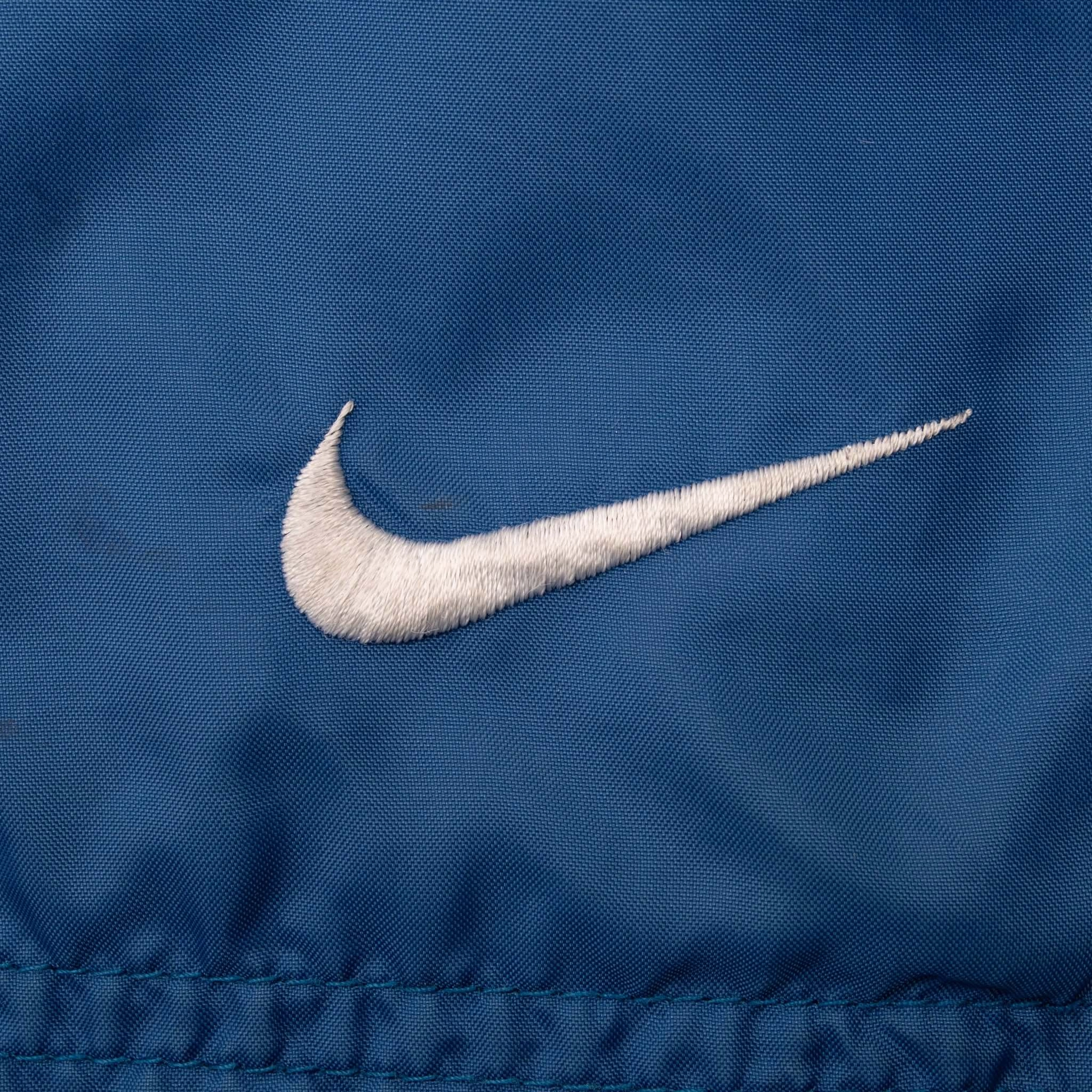 VINTAGE NIKE CLASSIC SWOOSH BLUE WINDBREAKER JACKET 1990S XL